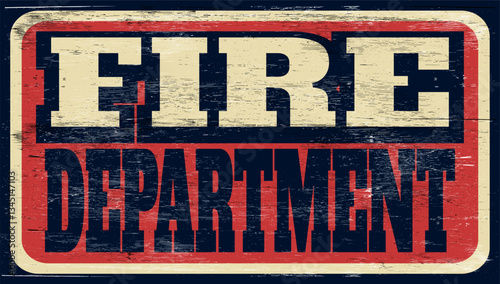 Aged vintage fire department sign on wood