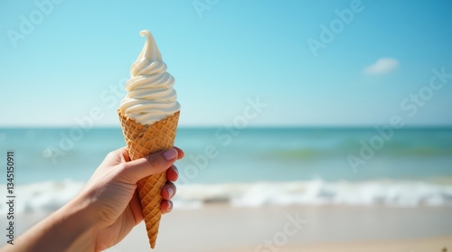 Hand holding soft serve ice cream with smooth creamy swirls, detailed waffle cone photo