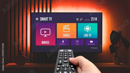 Man watching TV, remote control in hand
