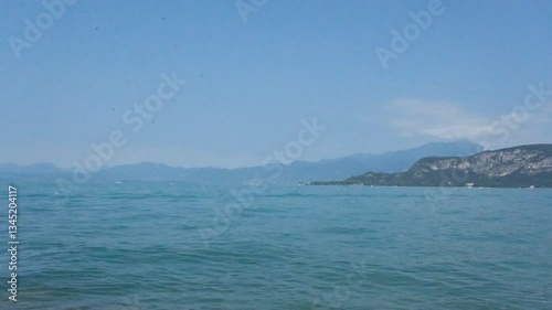 Panoramic view in Bardolino at the Garda Lake and ferris wheel in a typical Italian village from the pear