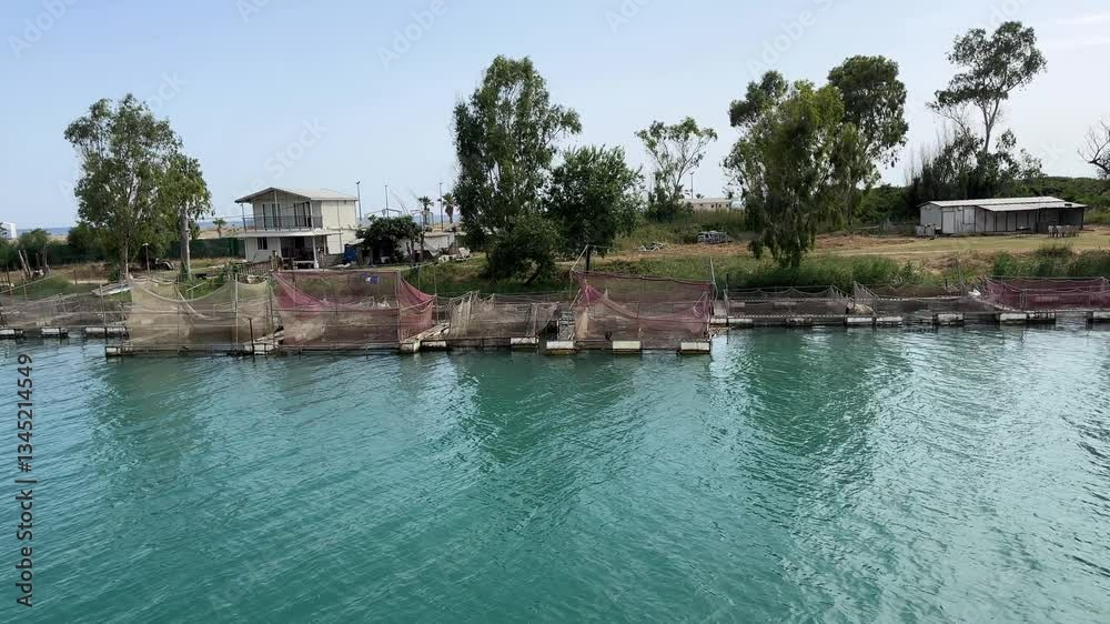 Fish Farming Nets Submerged in Manavgat River, Side, Turkey – Aquaculture in Flowing Water Fish Farming Nets Submerged in Manavgat River, Side, Turkey – Aquaculture in Flowing Water