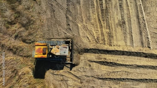 construction work of bulldozer during road construction. Large bulldozers level the sandy base. Epic footage of large construction equipment working. drone view of road construction. Overhead shot 