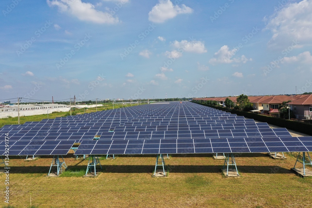 Solar Farm (solar cell) on sunny day background with electric power generation in agricultural area . Renewable green alternative energy. Power plant.Solar photovoltaic rows array ground mount system Solar Farm (solar cell) on sunny day background with electric power generation in agricultural area . Renewable green alternative energy. Power plant.Solar photovoltaic rows array ground mount system
