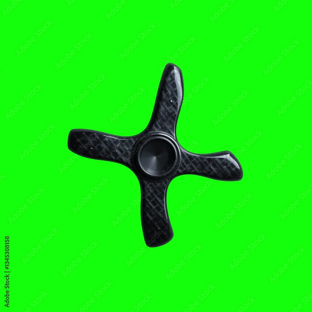 Sleek Black Quad-Blade Fidget Spinner Rotating on Vibrant Green Screen Background