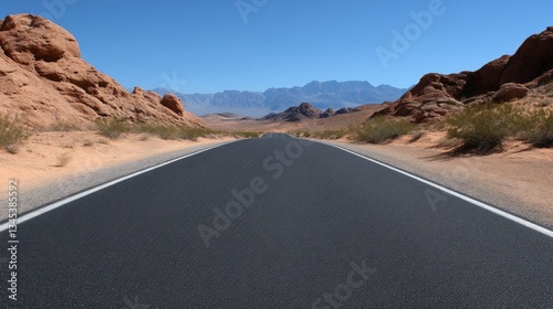 Empty Desert Highway Extends to Distant Mountains