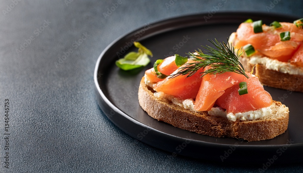 portion of gourmet bruschetta with red fish on black plate portion of gourmet bruschetta with red fish on black plate