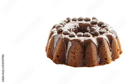 A chocolate bundt cake with chocolate glaze and coffee beans on a black background is displayed photo