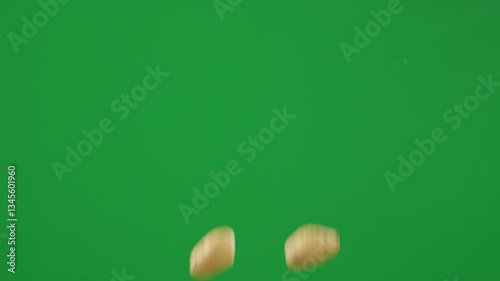 Cinematic Slow Motion of Fresh Potatoes Floating in The Air with Greenscreen Background. Organic potatoes, slow motion, wooden crate, green screen, harvest