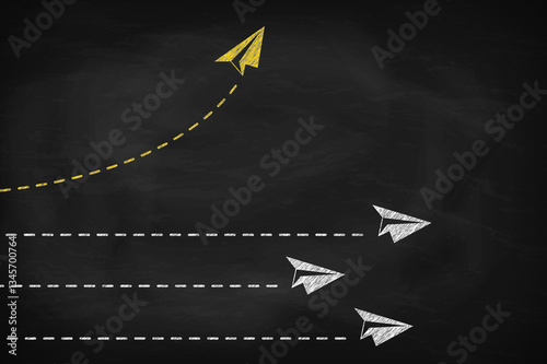 Yellow paper plane changing direction on black chalkboard. New idea, change concept of business