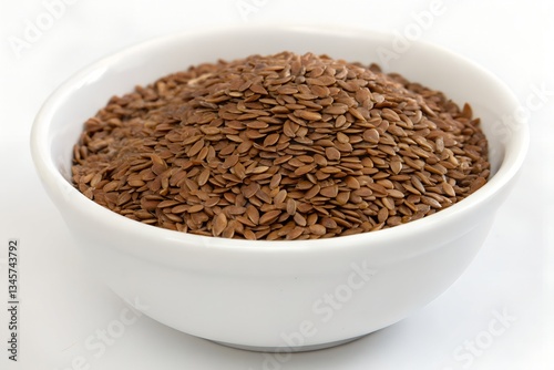 flaxseeds isolated in white bowl