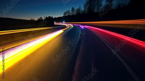 Night highway lights streak across asphalt
