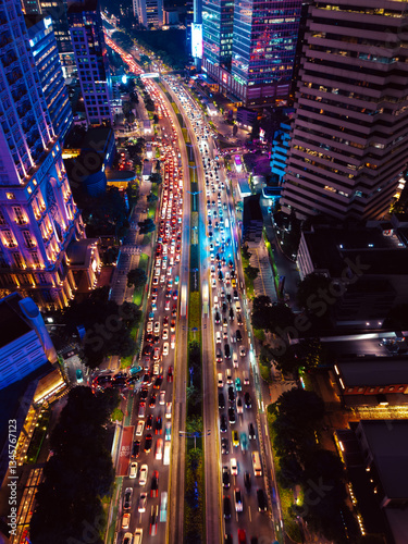 Night Cityscape with Busy Traffic and Illuminated Skyscrapers in Jakarta
