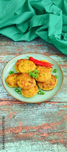 Perkedel Kentang
adalah makanan yang terbuat dari bahan baku kentang dan telur dengan cara di goreng, 