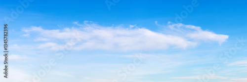  single white cloud in a clear blue sky on a bright day