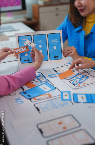 Web designers working on user experience and user interface of mobile application