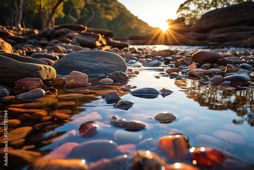 Behold, a picturesque tableau unfolds before your eyes, as ethereal allure of a riverbank or shore unveils itself, where harmonious interplay between steadfast rocks and flowing waters orchestrates a 