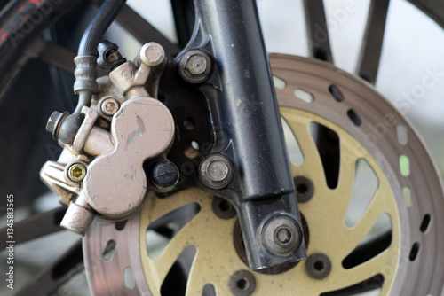 Disc brake caliper on the front wheel of a motorcycle