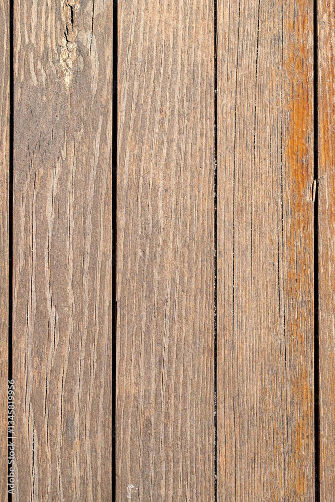 The image is of a wooden surface with a grainy texture The image is of a wooden surface with a grainy texture