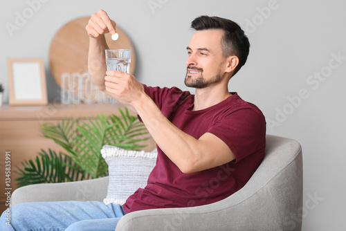 Young man putting soluble t...