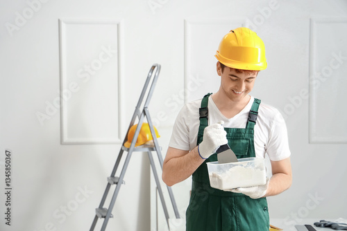 Male decorator with putty k...