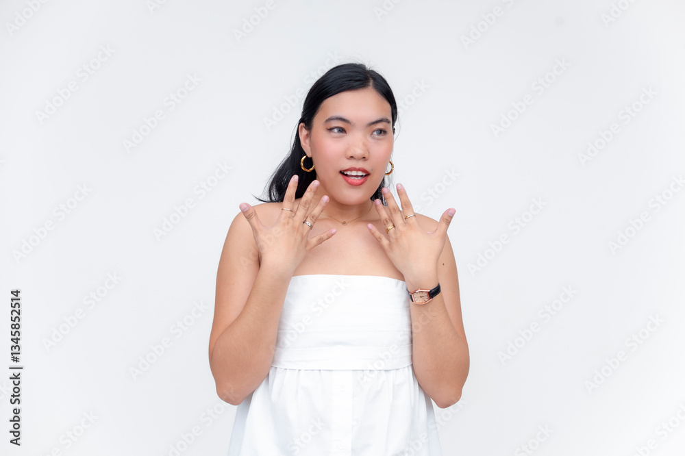 Asian woman in white dress isolated on white background with expressive hand gestures and joyful expression Asian woman in white dress isolated on white background with expressive hand gestures and joyful expression
