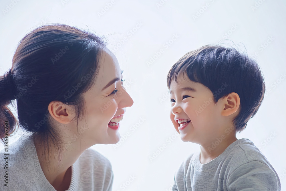 Studio Portrait of a Happy Asian Mother and Daughter: A Family Concept Featuring a Japanese Young Mother and Her Cute Son Interacting and Smiling in Front of a Plain White Background Studio Portrait of a Happy Asian Mother and Daughter: A Family Concept Featuring a Japanese Young Mother and Her Cute Son Interacting and Smiling in Front of a Plain White Background