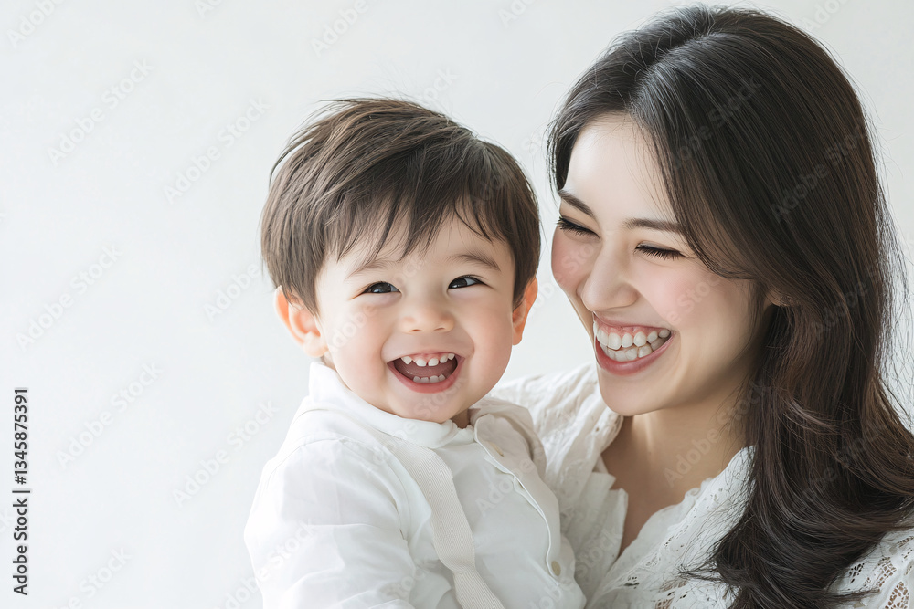 Studio Portrait of a Happy Asian Mother and Daughter: A Family Concept Featuring a Japanese Young Mother and Cute Son Interacting and Smiling in Front of a Plain White Background Studio Portrait of a Happy Asian Mother and Daughter: A Family Concept Featuring a Japanese Young Mother and Cute Son Interacting and Smiling in Front of a Plain White Background