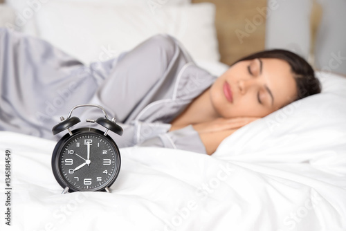 Wallpaper Mural Alarm clock on bed of beautiful sleeping young woman Torontodigital.ca