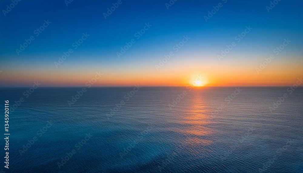Obraz premium a serene gradient of colors blending softly from warm orange to cool blue capturing the beauty of a sunset over the horizon