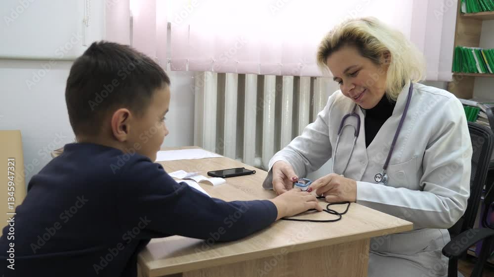 Doctor measures boy's oxygen saturation. Medical examination. Doctor measures boy's oxygen saturation. Medical examination.
