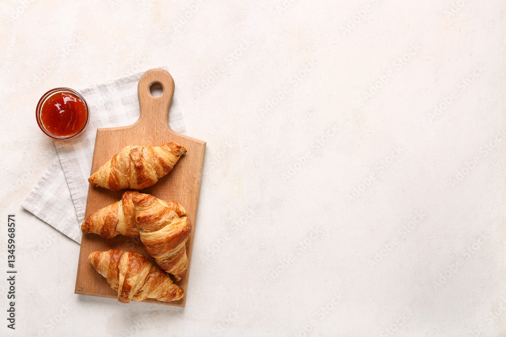 Fototapeta premium Wooden board with tasty croissants and bowl of jam on white background