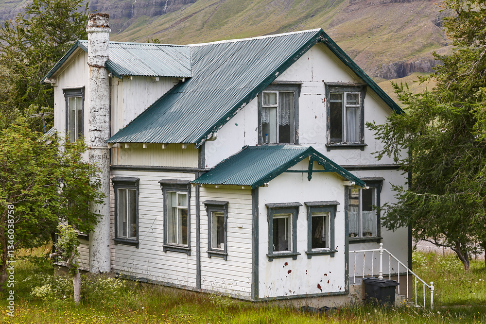 Picturesque rusty old traditional farm house. West fjords landscape. Iceland