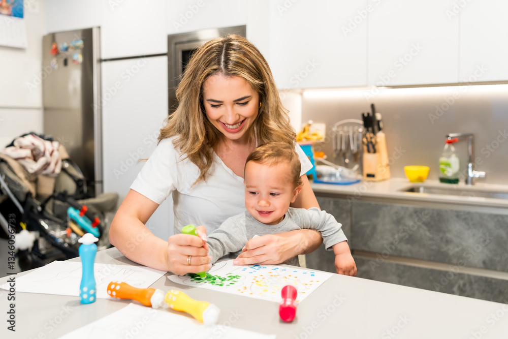 Fototapeta premium Mother and baby boy painting with dot markers at home