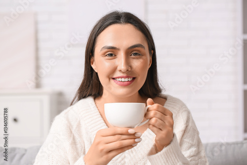 Young woman with cup of cof...