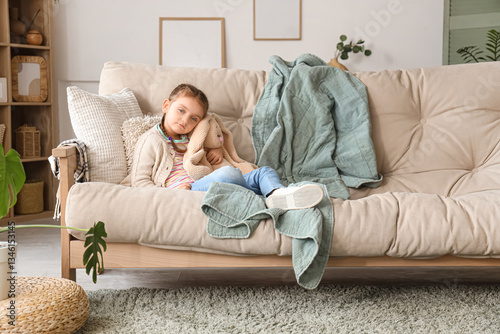 Sad ill little girl with to...