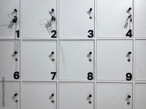 Changing locker on the pool. School lockers with open doors and sports equipment, items and accessories for sports.Lockers with lots of beautiful colors on the walls