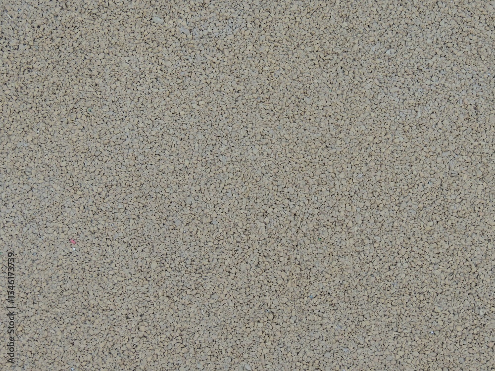 sports flooring made of rubber crumb with a grainy texture in gray monochrome color, close-up, full frame, rubber material for covering sports tracks and playgrounds gray shade sports flooring made of rubber crumb with a grainy texture in gray monochrome color, close-up, full frame, rubber material for covering sports tracks and playgrounds gray shade