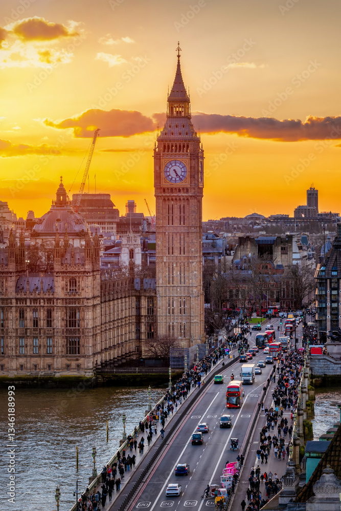 The Big Ben clocktower and Westminster Bridge in London, England, during a golden sunset