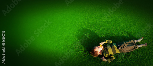 The child goes in for sports at the stadium. The boy training before playing football. banner with copy space