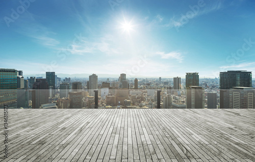 Fototapeta Naklejka Na Ścianę i Meble -  Rooftop empty brick floor with panoramic city skyline.