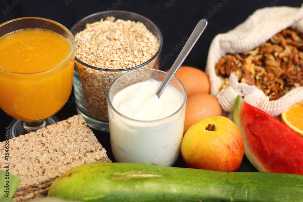 Various healthy fruits, vegetables and cereals on dark background. Selective focus.