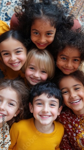 A group of smiling children looking up together happily