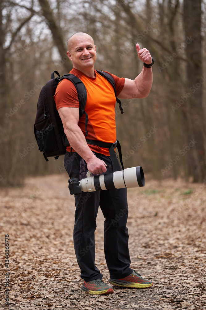 Fototapeta premium Photographer giving thumbs-up in the forest........