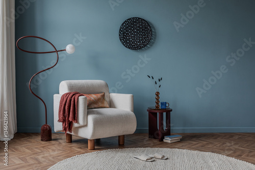 Cozy reading nook with a curved white armchair, warm rust-toned textiles, and a sleek sculptural floor lamp.