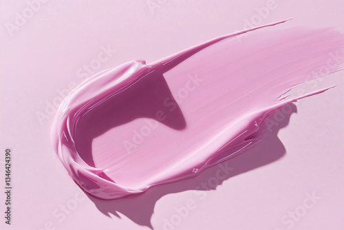 Texture pink cream gel cosmetic smudge on pink background, lipstick or blush or eye shadow or nail polish smudge trendy colore	