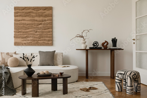 Fotografía Minimalist living room with neutral tones, textured wall art, and modern decor elements