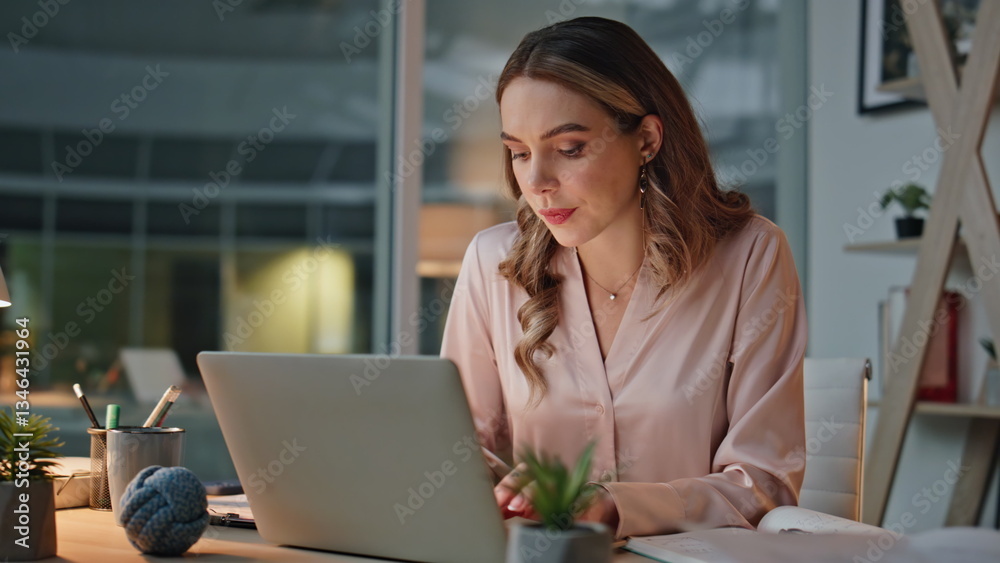 Obraz premium Late businesswoman using laptop in cozy office closeup. IT employee taking notes
