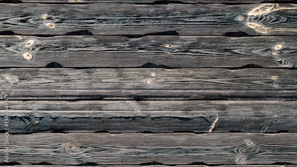 Naklejka premium texture of a dark wooden wall with knots