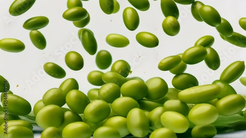 Vibrant green capsules floating in air create lively scene for health enthusiasts.