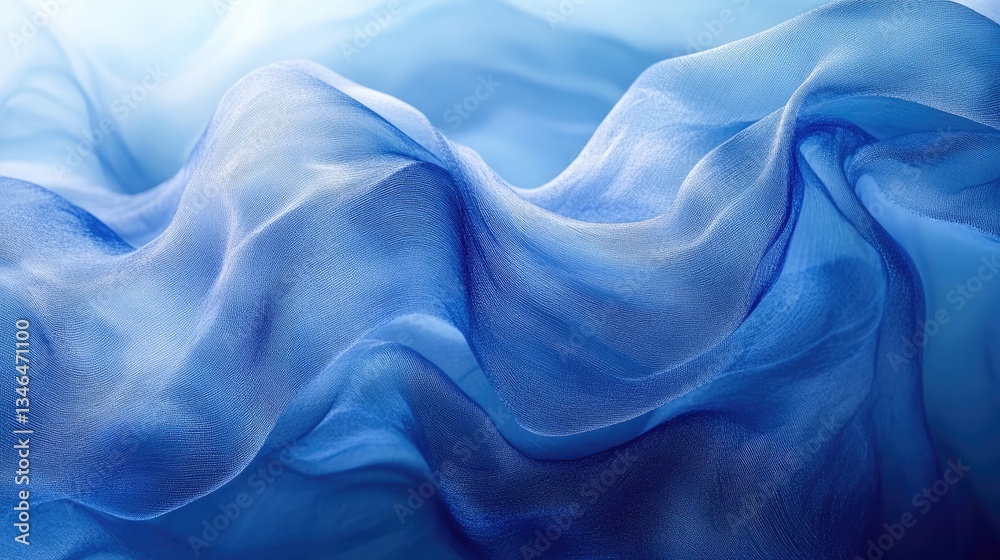 Obraz premium Blue silk fabric waves, studio shot, background blur, design texture